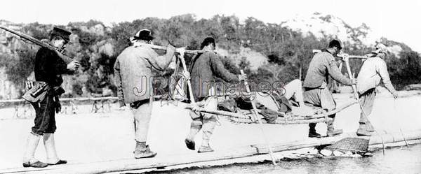 Coolie stretcher-bearers carrying wounded