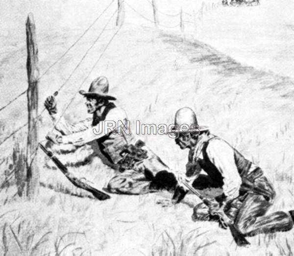 Two cattle ranchers clipping a barb wire fence