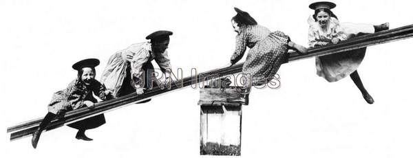 Early1900's girls playing on primitive seesaw