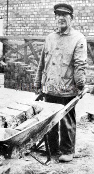 One-armed man working on a building project