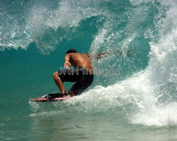 Surfer at Sandy Beach