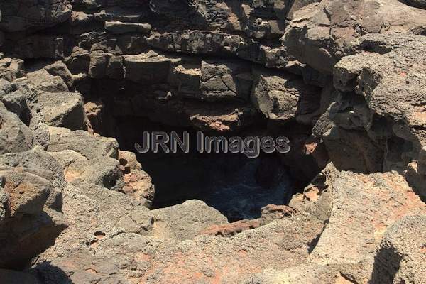 Hole in lava rock with pool, Ka Lae (South Point)