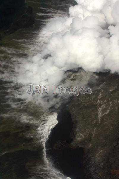 Lava from Pu'u 'O'o Vent flowing into the ocean;...