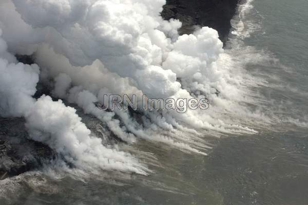 Lava from Pu'u 'O'o Vent flowing into the ocean;...