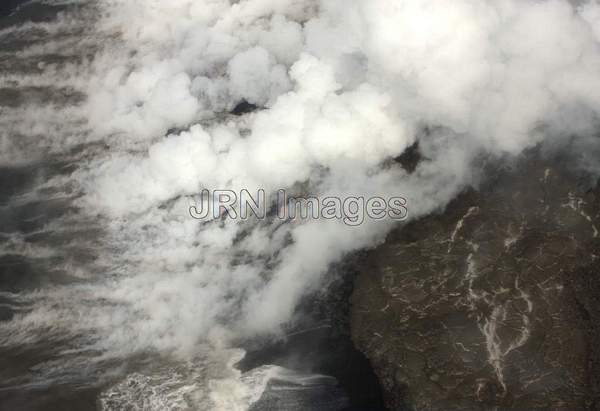 Lava from Pu'u 'O'o Vent flowing into the ocean;...