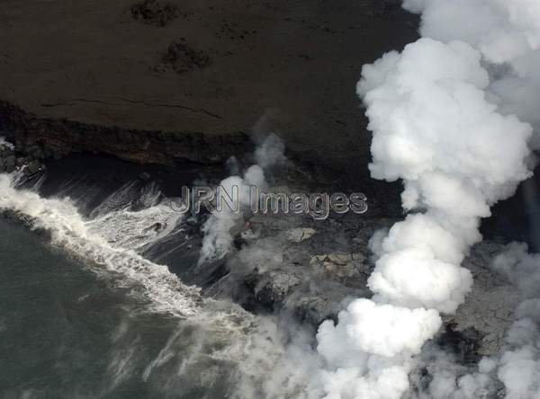 Lava from Pu'u 'O'o Vent flowing into the ocean;...