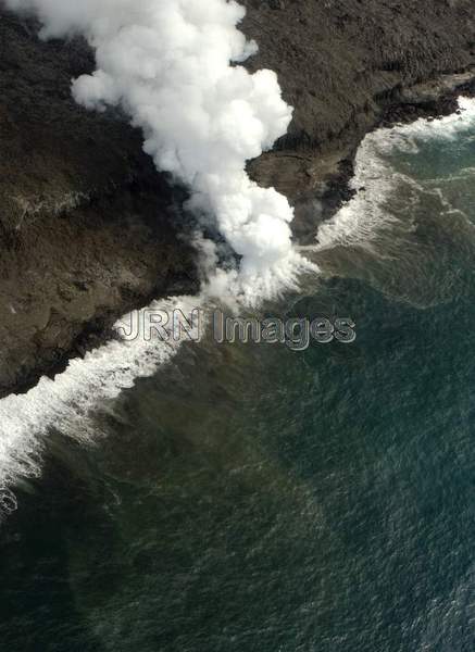 Lava from Pu'u 'O'o Vent flowing into the ocean;...