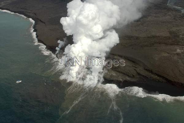 Lava from Pu'u 'O'o Vent flowing into the ocean;...