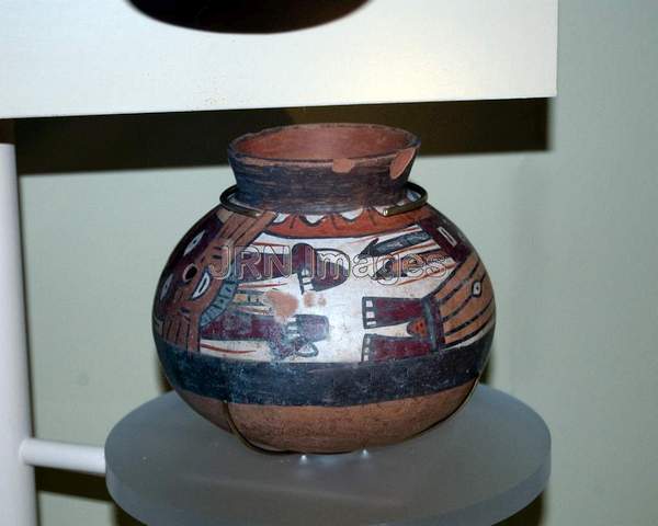 Ceramic vessel with whiskered deity