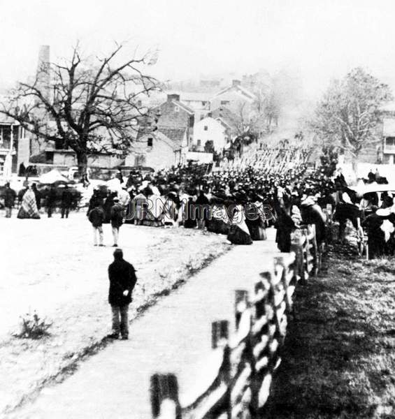 Union troops marching through village